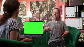Therapist uses green screen display in a counseling session with an adolescent dealing with low confidence. Psychotherapist supports her in building resilience and self esteem. Camera B. video