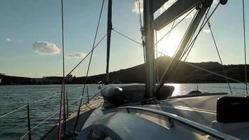Sailing Yacht Makes A Slow Turn In A Sea Bay Onboard View video