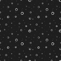 Seamless pattern with hand drawn white circles scattered on black background. Modern abstract design for print or textile. vector