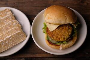 burger tempeh. low carbohydrate vegan tempeh burger. healthy food. suitable for weight loss and diet photo