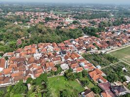 aerial view of a village in the countryside. rice fields around the village. photo