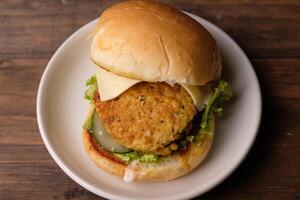 burger tempeh. low carbohydrate vegan tempeh burger. healthy food. suitable for weight loss and diet photo