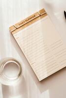 Top view minimalist daily planner with a simple design, featuring checkboxes and lines for tasks photo