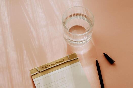 Flat lay minimalist daily planner with a simple design, featuring checkboxes and lines for tasks. photo