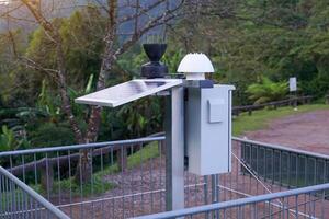 The solar automatic telemetry station is installed high on a mountain to measure climate data, rainfall, and water levels in upstream forest areas. photo