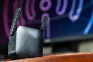 Black Router with Antennas and Abstract Background photo