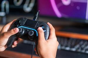 Gaming with Wireless Controller and Neon Wu-F Symbol photo