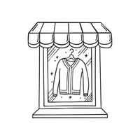 A cardigan displayed over a store front window vector