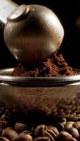 Professional barista worker man using grinder machine to grind fresh coffee beans and press into portafilter video