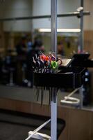 A collection of hair cutting scissors displayed in a barbershop setting photo