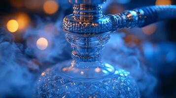 Close-up of a hookah with smoke and bokeh lights. Relaxation and leisure concept photo