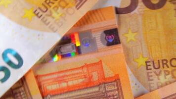 50 Euro Banknotes, Rotating Money Background - Top View. Euro Money Currency. Orange Paper Money. A Lot of Fifty Euro Bills. Business, Finances, Cash and Money Saving Concept - Angular Rotation video