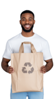 Smiling man holding brown paper bag with recycling symbol on transparent background png