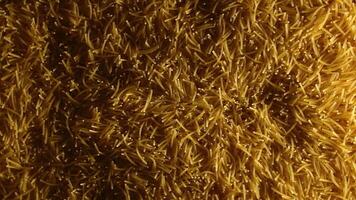 Background of Uncooked Noodles that Slowly Rotating Clockwise - Top View. Texture of Dry Vermicelli Turning Around. Raw Pasta with Low Key Light - Right Rotation video