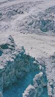 Active runner jogging outdoor. Aerial view of athletic young man running in the nature Vertical video
