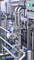 Automated modern dairy factory. Production of milk in a dairy factory Vertical video