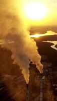 Old smokestack of factory. Pollution and smoke from chimneys of factory Vertical video