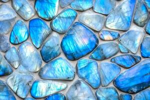 Abstract background of polished blue labradorite showcasing iridescent colors in a smooth gradient pattern photo