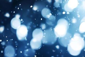 Soft white particles drift in an abstract snow flurry against a dark background, creating a dreamy winter atmosphere photo