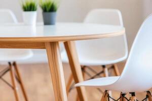 Diverse team engaged in conversation around a round table in a modern, minimalistic workspace photo