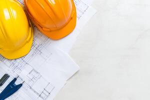 Workers collaboratively discussing blueprints in an industrial office setting with a modern minimalist design photo