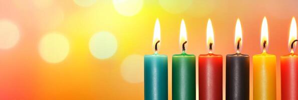 Kwanzaa candles shining brightly with vibrant colorful lights in the background symbolizing unity and heritage photo
