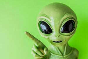 Playful green alien pointing at viewers against a bold neon green background, inviting interaction with a fun expression photo