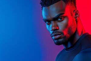 Athletic man showcasing his muscular build in focused pose against a gradient studio backdrop photo