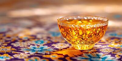 Enjoying a cup of Persian tea with saffron on a colorful carpet in a cozy setting photo