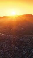 Panorama of the city surrounded by agricultural fields. Beautiful scenery of Napa, California, USA at setting sun. Orange sky at backdrop. Vertical video