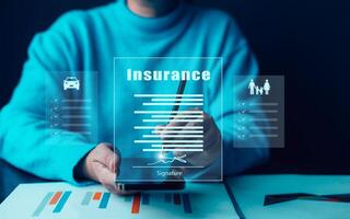2025 Insurance form agreements concept, Businessman signs insurance contracts e-signing digital online, document management, concerning mortgage loan offer for and house insurance photo