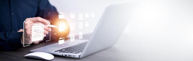 Online survey filling out and digital form checklist by laptop computer, Document Management Checking System, online documentation database and process manage files. photo