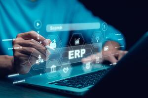 Business people using a laptop with document management for ERP. Enterprise resource planning concept,Enterprise Resource Management ERP software system for business resources plan presented. photo