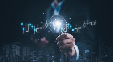 businessman hand type on the laptop of company profit with colleagues partner explain with virtual dashboard statistic chart stock infographic, graphs, cryptocurrency, and new trading platforms photo