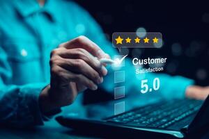Quality assurance of business services, Businessman Hand shows the sign of the top service Quality assurance in Black background , Guarantee, Standards, ISO certification and standardization concept. photo