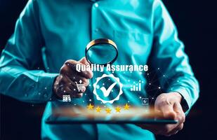 Quality assurance of business services, Businessman Hand shows the sign of the top service Quality assurance in Black background , Guarantee, Standards, ISO certification and standardization concept. photo