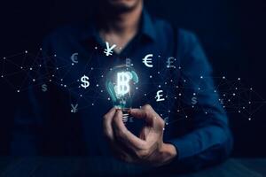 Businessman hand hold bitcoin and icon of business network on White background. bitcoin cryptocurrency ideas concept and virtual financial chart diagram, Digital symbol of a new virtual currency photo