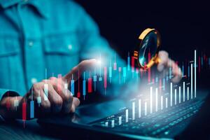 businessman hand type on the laptop of company profit with colleagues partner explain with virtual dashboard statistic chart stock infographic, graphs, cryptocurrency, and new trading platforms photo