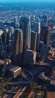 Marvelous Los Angeles skyscrapers in financial downtown. City scenery with hazy horizon at backdrop. Top view. Vertical video