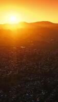 Napa city, California, USA in the rays of setting sun. Fantastic panorama of the valley with mountains at backdrop. Aerial view. Vertical video