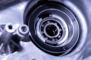Disassembled view of a ball bearing in the transfer case housing of an SUV. Tinted image with space to copy. Transmission repair photo