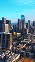 Skyscrapers in the downtown Los Angeles, California, USA. Beautiful modern architecture at backdrop of azure skies. Vertical video