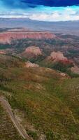 Azure cloudy skies over the mountainous landscape of Utah canyons. Beautiful rocks of Zion National park from top view. Vertical video