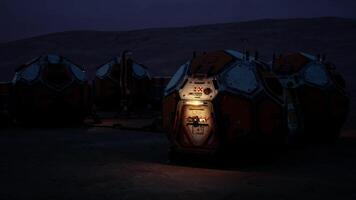 Mars colony base structures illuminated at dusk with scientific equipment video