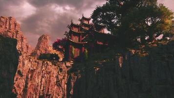 Serene Asian temple nestled in mountains during twilight hour video
