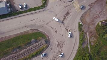 View from the height. Clip. A small fork in the road of cars with fast-moving vehicles. video