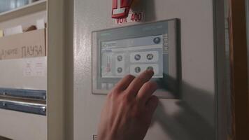 Close-up of worker clicking on industrial panel with buttons. Creative. Modern control panel for industrial machines. Electronic panel with buttons for controlling equipment at factory video