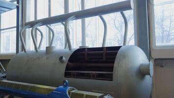 Nuclear Reactor Steam Generator. Stock footage. Tank of steam generator inside old room. Internal steam generator system with indoor housing video