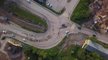 View from the height. Clip. A small fork in the road of cars with fast-moving vehicles. video