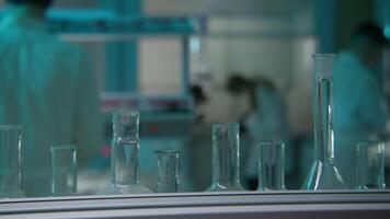 View of a glass test tubes and flasks in a laboratory. Stock footage. Concept of medicine and science. video